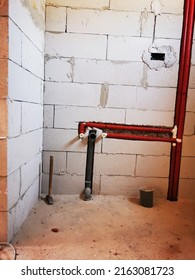 Polypropylene Plumbing Pipes In The Wall. New Construction Of The Bathroom, Installation Of Plastic Pipes With Insulation Inside The Wall