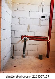 Polypropylene Plumbing Pipes In The Wall. New Construction Of The Bathroom, Installation Of Plastic Pipes With Insulation Inside The Wall