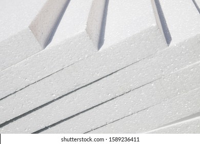 Polystyrene insulation boards. Polystyrene plates warehouse. Polystyrene Stack
