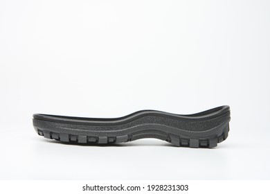 Polyurethane sole to sneakers. Black sole of shoes on a white background. Rubber sole for production of sneakers. Concept - components or spare parts to production of footwear. Production sneakers