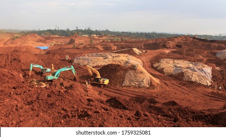 Pomalaa, Indonesia - June 19, 2011: Open Nickel Mining Activity By Clearing Land Using Heavy Axle Excavators
