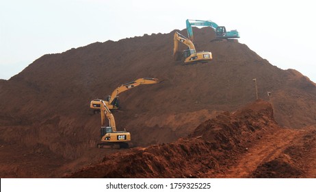 Pomalaa, Indonesia - June 19, 2011: Open Nickel Mining Activity By Clearing Land Using Heavy Axle Excavators
