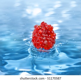 Pomegranate Fruit Seeds Falling In A Refreshing Drink