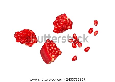 Pomegranate fruit slices isolated on a white background.