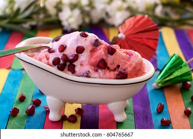 Pomegranate Ice Cream In A Small Tub