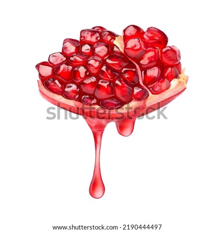 Pomegranate juice dripping isolated on white background.