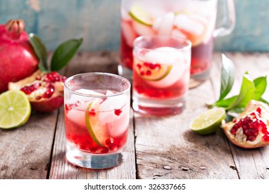 Pomegranate Margarita Cocktail With Lime Slices And Ice