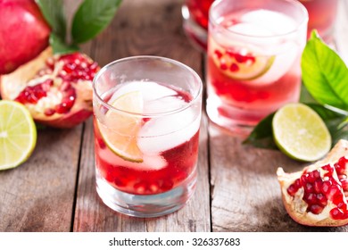 Pomegranate Margarita Cocktail With Lime Slices And Ice