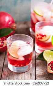 Pomegranate Margarita Cocktail With Lime Slices And Ice