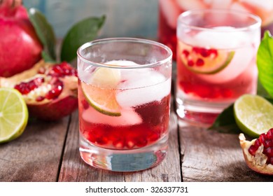 Pomegranate Margarita Cocktail With Lime Slices And Ice