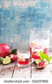 Pomegranate Margarita Cocktail With Lime Slices And Ice