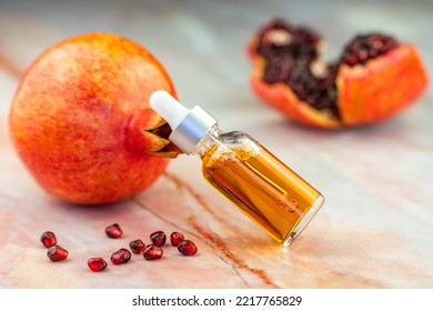 Pomegranate Oil In A Cosmetic Bottle With A Pipette. 