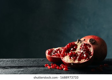 Pomegranate on wooden table, space for text. Juicy fruit - Powered by Shutterstock