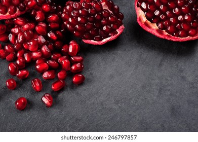 pomegranate seeds  over black background