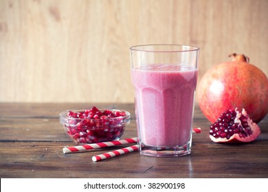 Pomegranate Smoothie On Wooden Background