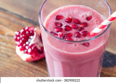 Pomegranate Smoothie On Wooden Background