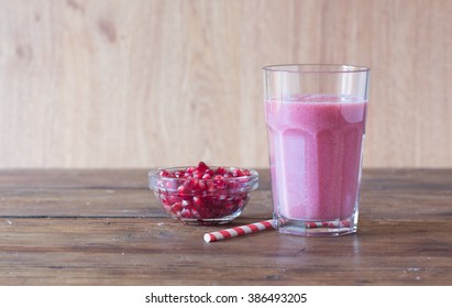 Pomegranate Smoothie On Wooden Background