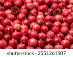 Pomegranates whole and sliced ​​as background