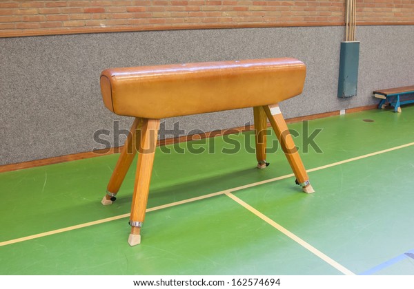 Pommel horse in an old\
dutch school gym