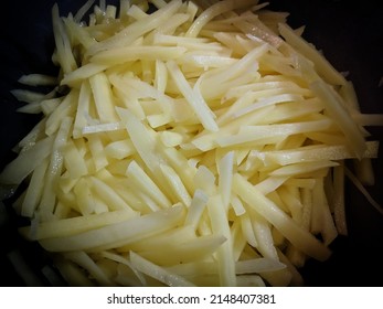 Pommes Frites,Isolated Potatoes With French Fries On White Background, Concept Of Cooking Potatoes Top View, Frozen Potatoes, French Fries, Canned Food.Bown With Fresh Cooked French Fries Potato Chip