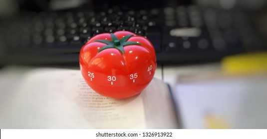 Pomodoro Timer On The Desk.