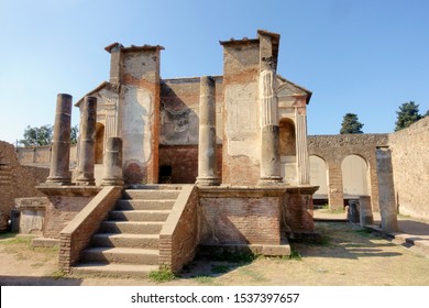 Pompeii ruins: Temple of Isis with columns. Remains of the ancient Pompeii town destroyed by eruption of volcano Vesuvius.No people                     