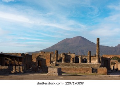 Pompeii Ruins And Vesuvius In The Background.