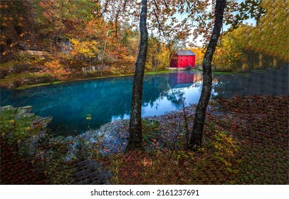 Pond in the autumn forest. Old red barn reflection in pond water in autumn forest. Autumn forest pond reflection. Autumn pond landscape