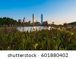 Pond at Bicentennial Park in the wealthy Vitacura district and skyline of buildings at financial district, Santiago de Chile
