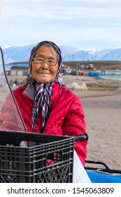 Pond Inlet, Baffin Island, Canada - August 23, 2019: Portrait of a eskimo - inuit senior woman outdoors in Pond Inlet, Baffin Island, Canada.