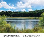 A pond inside Sunnybrook State Park in summer in New England Torrington Connecticut United States.