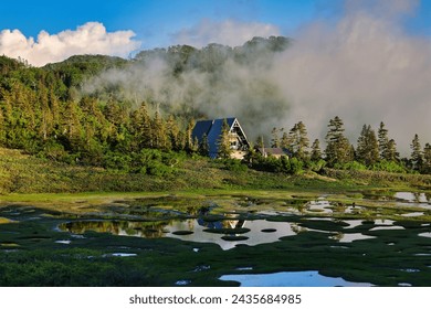 Pond and mountain hut of Mt. Hiuchi in Japan - Powered by Shutterstock