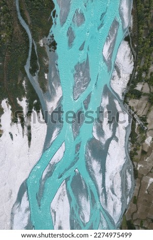 A pond river lake in Karakoram high mountain hills. Nature landscape background, Skardu, Gilgit, Pakistan. Travel on holiday vacation. Glacial ice abstract pattern art texture background