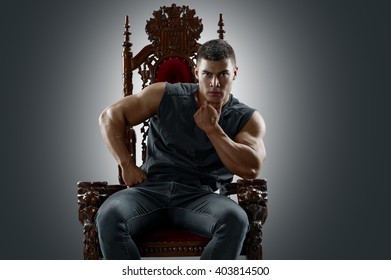 Ponderer Muscular Man On The Throne