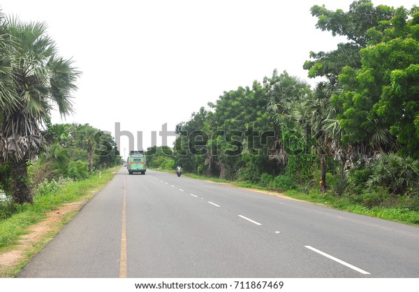 Pondicherry, India - Sep 8: Indian highway in\
Pondicherry, India on Sep 8, 2017. Indian highway with trucks and\
vehicles on the\
move.