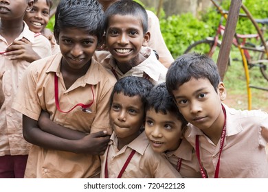 PONDICHERY, PUDUCHERY, INDIA - SEPTEMBER 04, 2017. Happy kids with school uniforms play in the school, excited to see french photographer in their school. - Shutterstock ID 720422128