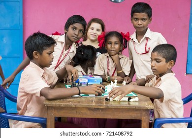 PONDICHERY, PUDUCHERY, INDIA - SEPTEMBER 04, 2017. Indian children playing chess at the table. at school the concept of childhood and board games, brain development and logic