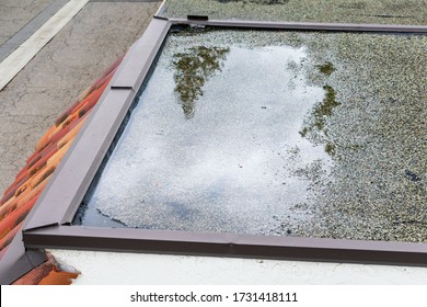 Ponding Standing Water On A Flat Roof After Rain.