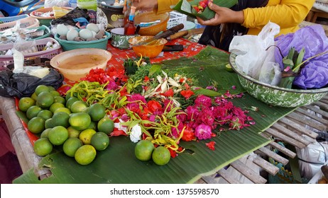 Ponorogo,Indonesia-04/19/2019: A woman is buying and selling transactions in traditional markets. These fruit traders and florists are serving customers