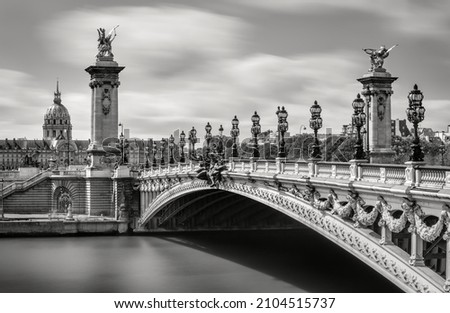 Pont Alexandre III Bridge over the Seine River with view of the Invalides in Black and White (UNESCO World Heritage Site). 7th Arrondissement, Paris, France