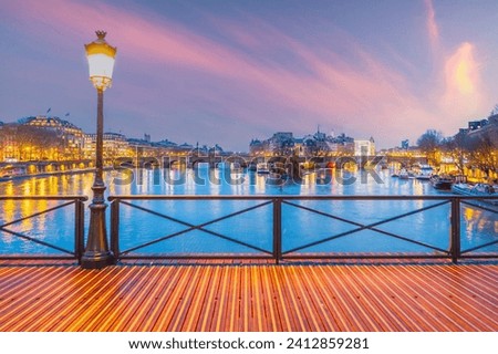 Pont des Arts bridge in Paris France and the River Seine at sunrise