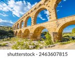 The Pont du Gard ancient Roman aqueduct bridge built in the first century AD to carry water to Nîmes. It crosses the river Gardon near the town of Vers-Pont-du-Gard in southern France.