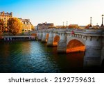 Pont Neuf at sunny fall sunset, Paris, France