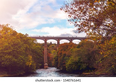 Pontcysyllte Aqueduct is a navigable aqueduct that carries the Llangollen Canal across the River Dee in the Vale of Llangollen in north east Wales, UK. Autumn Scenery