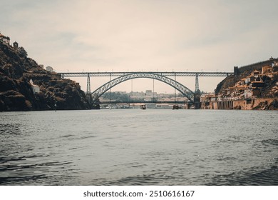 Ponte Dom Luís I bridge over the Douro River in Porto, shot from the centre of the river on tour boat, Porto, Portugal  - Powered by Shutterstock