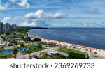 Ponte Negra beach at downtown Manaus Brazil. Landmark beach attraction at Black River at city of Manaus Brazil near Amazon River and Amazon Rainforest. Relaxation scenery. Urban beach Amazonas state.