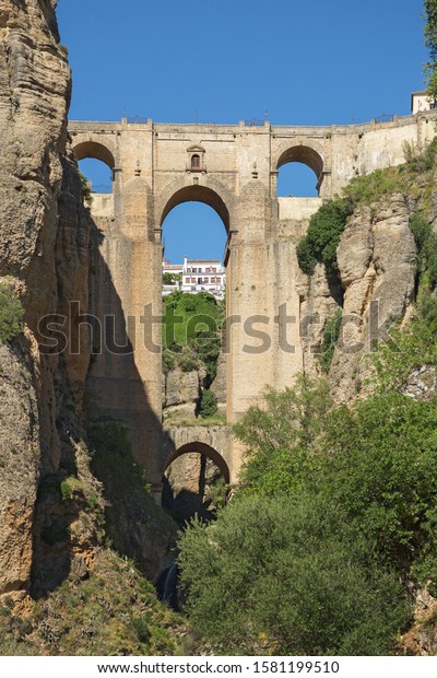 Ponte Nuevo (the New Bridge) in\
Ronda, Spain. This bridge spans the 120-metre-deep (390 ft) chasm\
that carries the Guadalevín River and divides the city of\
Ronda