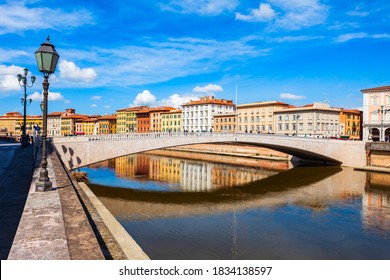 Ponte Solferino bridge and colorful houses at the Arno river waterfront in the centre of Pisa city in Tuscany, Italy