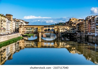 Ponte Vecchio, old bridge over Arno River with beautiful water reflection, Florence, Tuscany, Italy