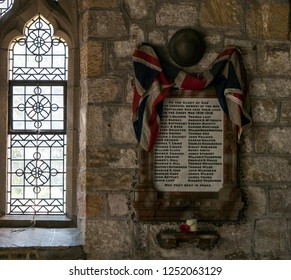 Ponteland, England - September 2nd 2017: Memorial To Lost Soldiers In World War 1. British Army Helmet And Union Jack Flag Inside Church With Poppy.